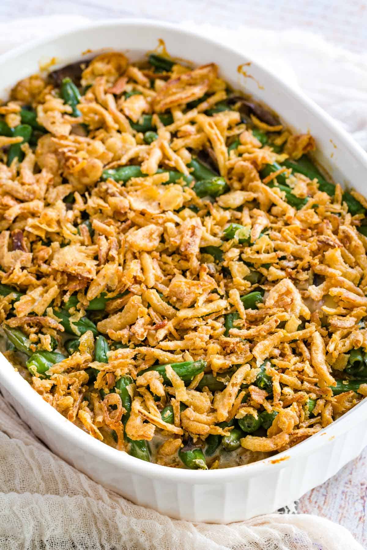 Gluten-free green bean casserole in a large white baking dish.