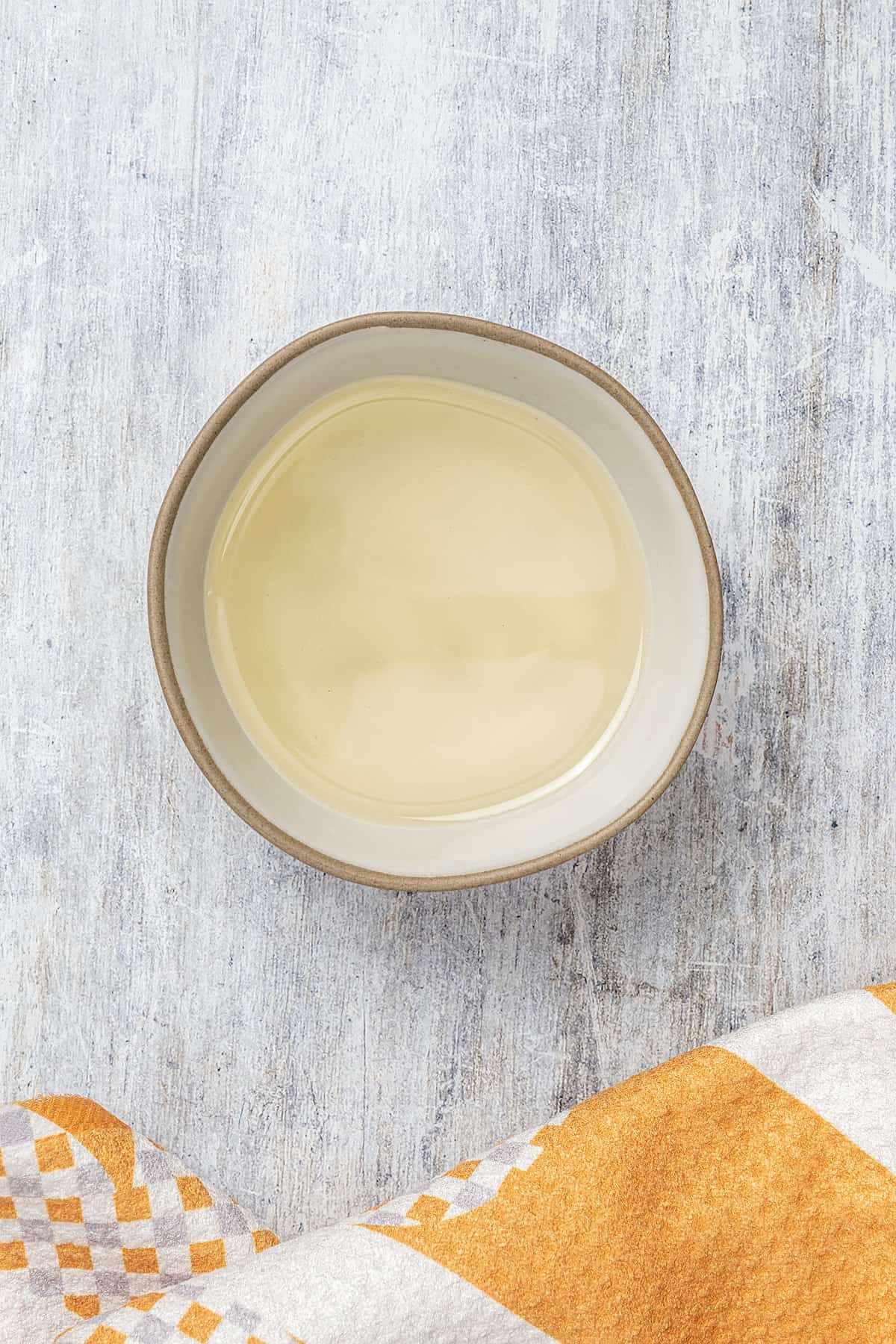 Overhead view of shortening in a bowl.