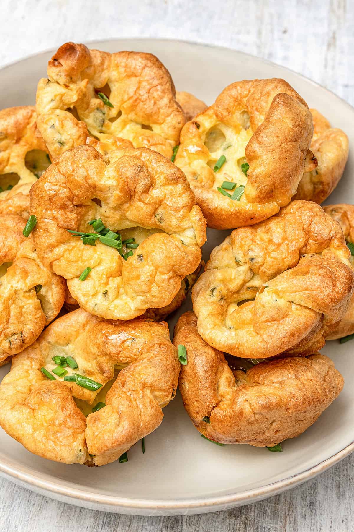 Gluten-free Yorkshire pudding arranged on a serving plate.