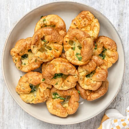 Top view of gluten-free Yorkshire pudding arranged on a serving plate.