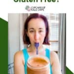 A photo of a woman holding a jar of peanut butter and licking a spoon on a white and green background with text that says "Is peanut butter gluten free?"