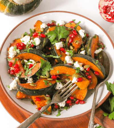 Baked Buttercup Squash pieces with Goat Cheese and pomegranate seeds.