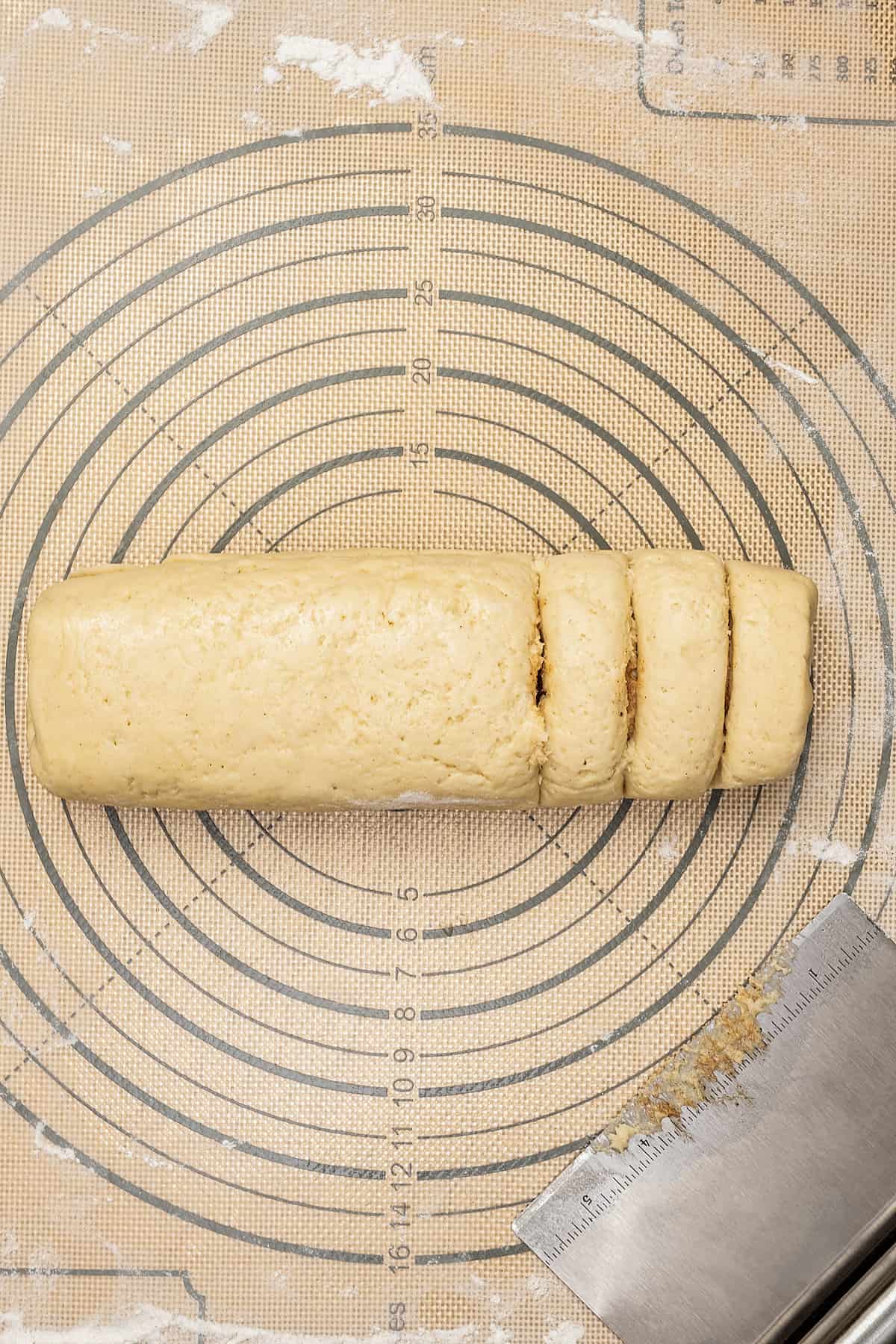 A rolled honey bun log cut into slices.