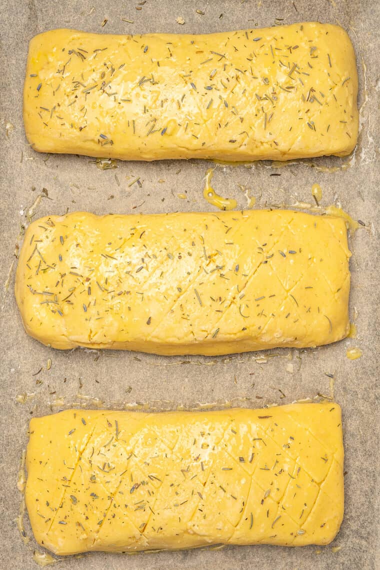 Wrapped Salmon Wellingtons on a parchment-lined baking sheet.