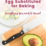 An avocado on a cutting board with a knife with text overlay that says "Egg Substitutes for Baking".