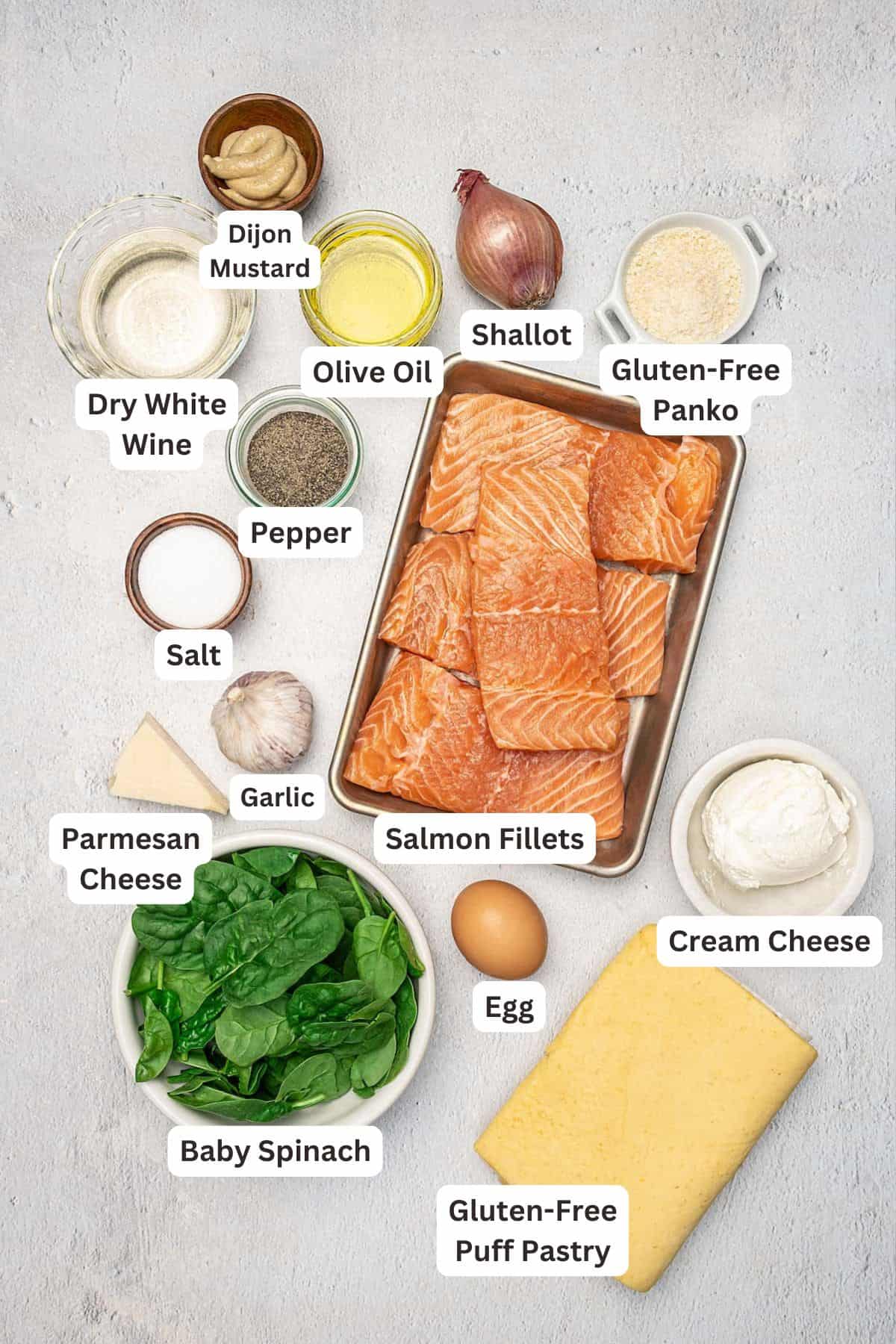 A quick and easy Salmon Wellington made with flaky salmon fillet and cheesy spinach filling, baked "en croute" inside gluten-free puff pastry. Ingredients for Gluten Free Salmon Wellington.