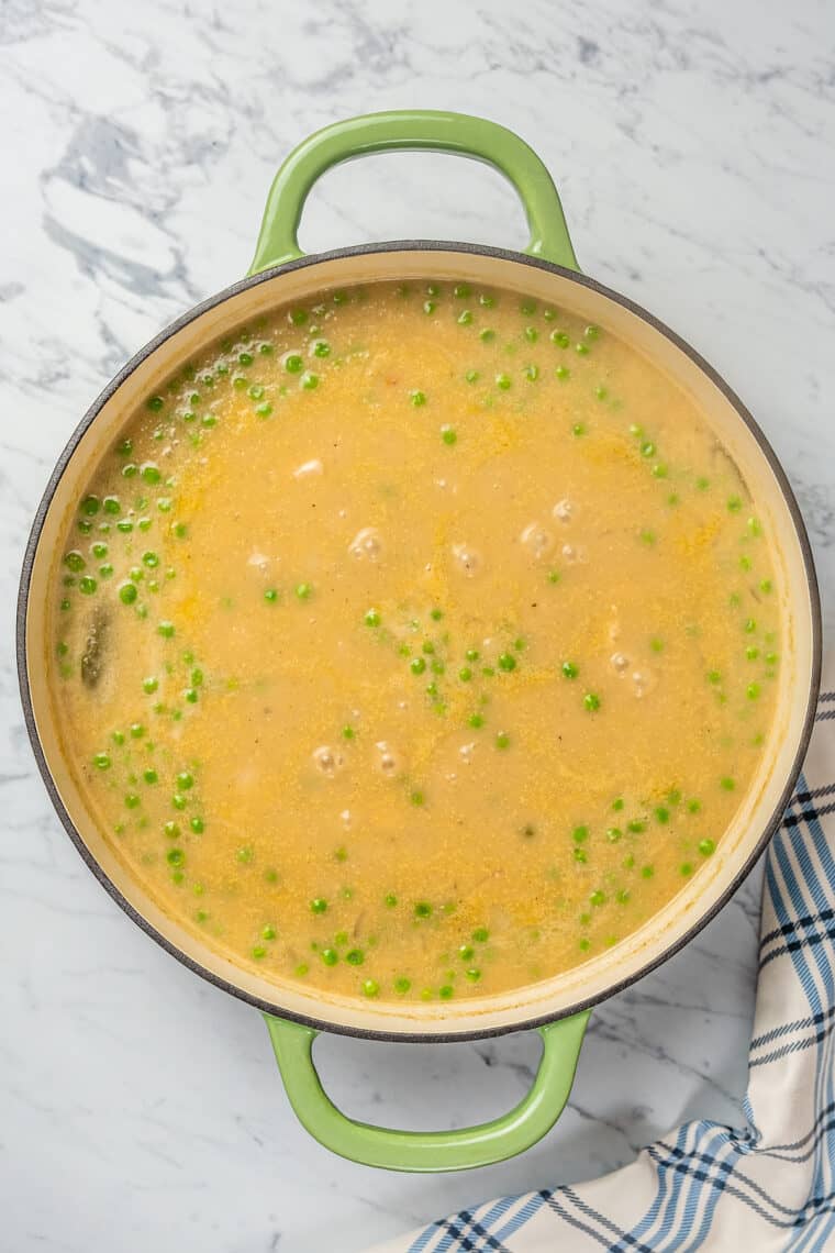 Creamy chicken soup in a large pot.