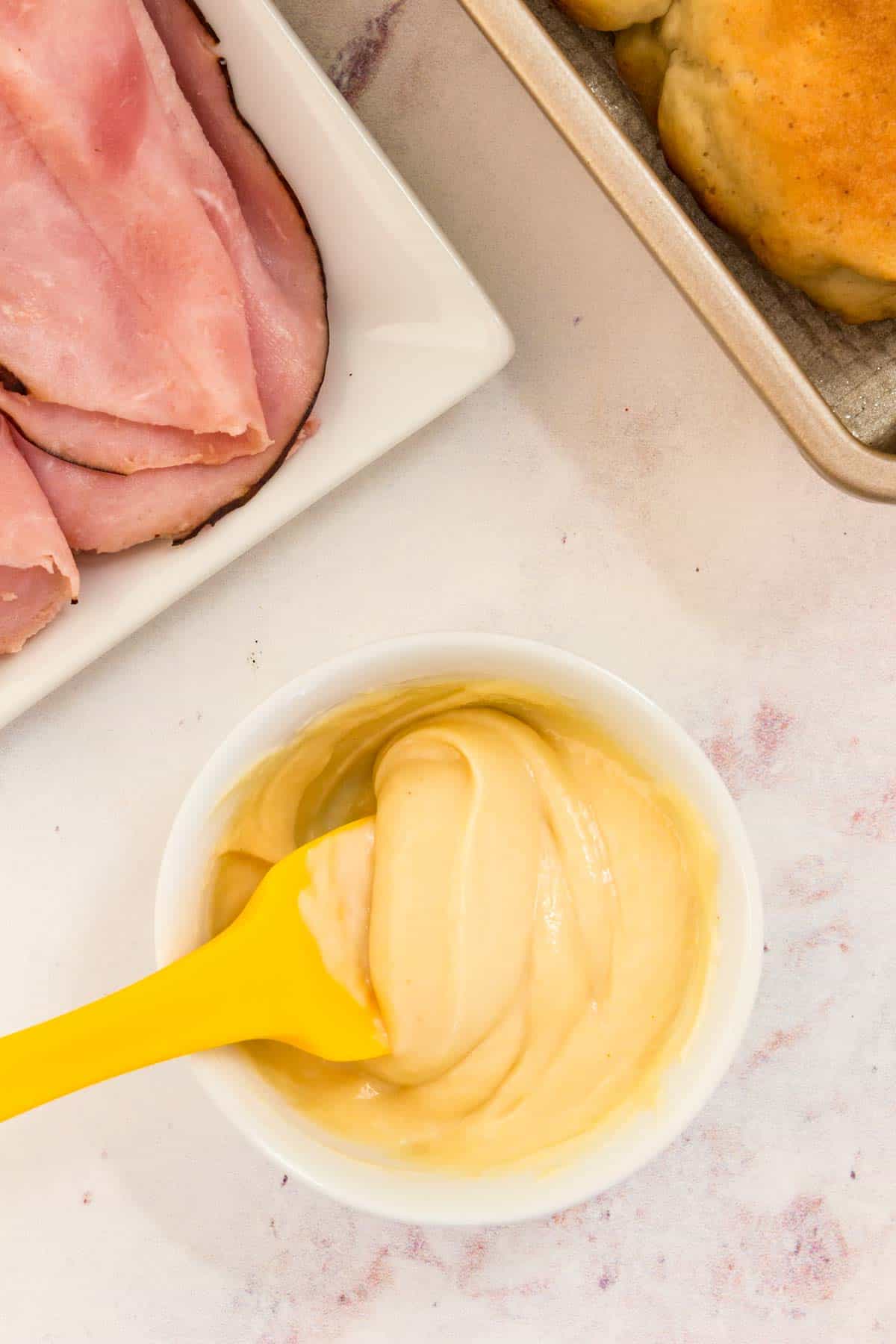 Mustard and mayonnaise mixed together in a small dish.