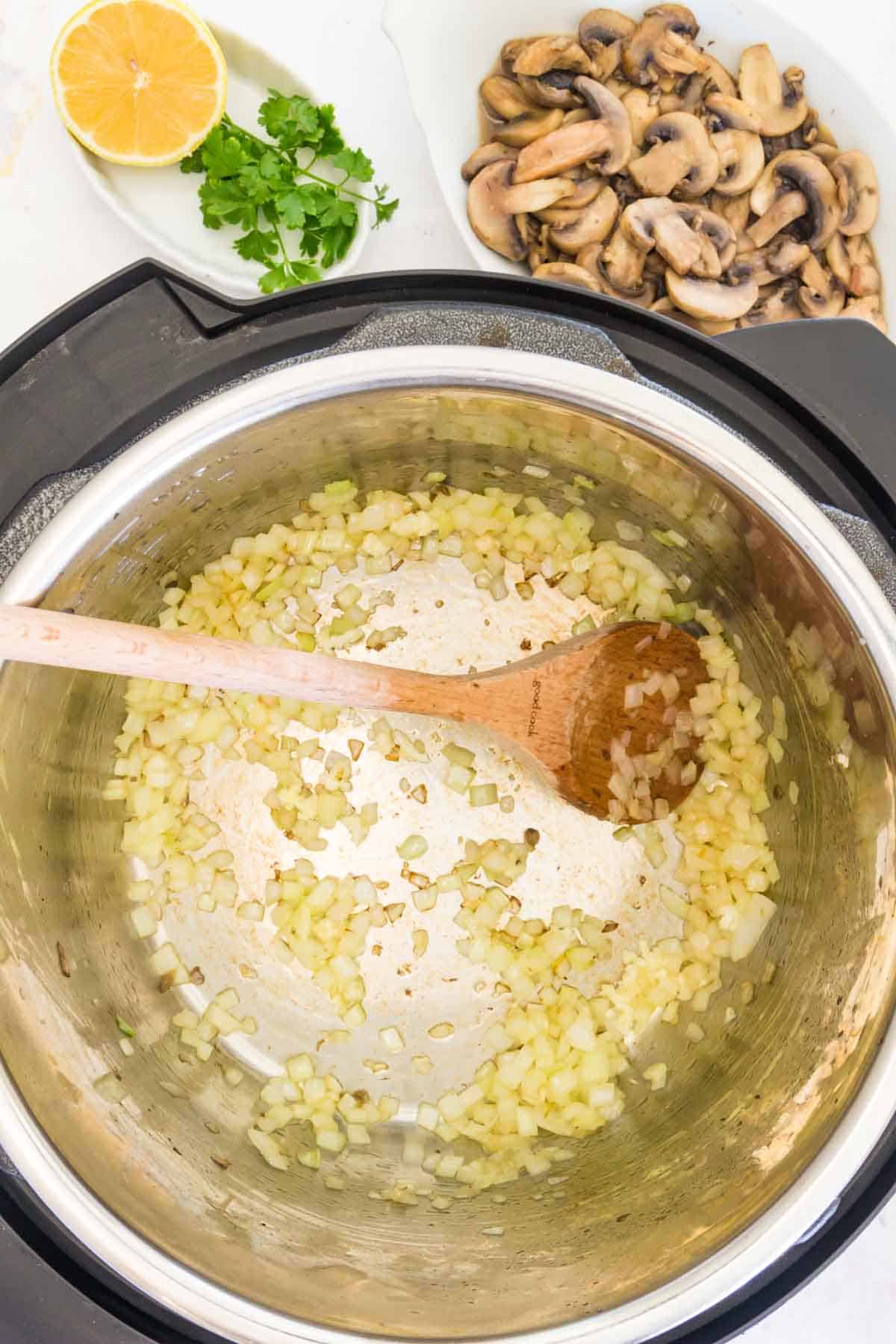 Onion and garlic sauteing inside the Instant Pot.