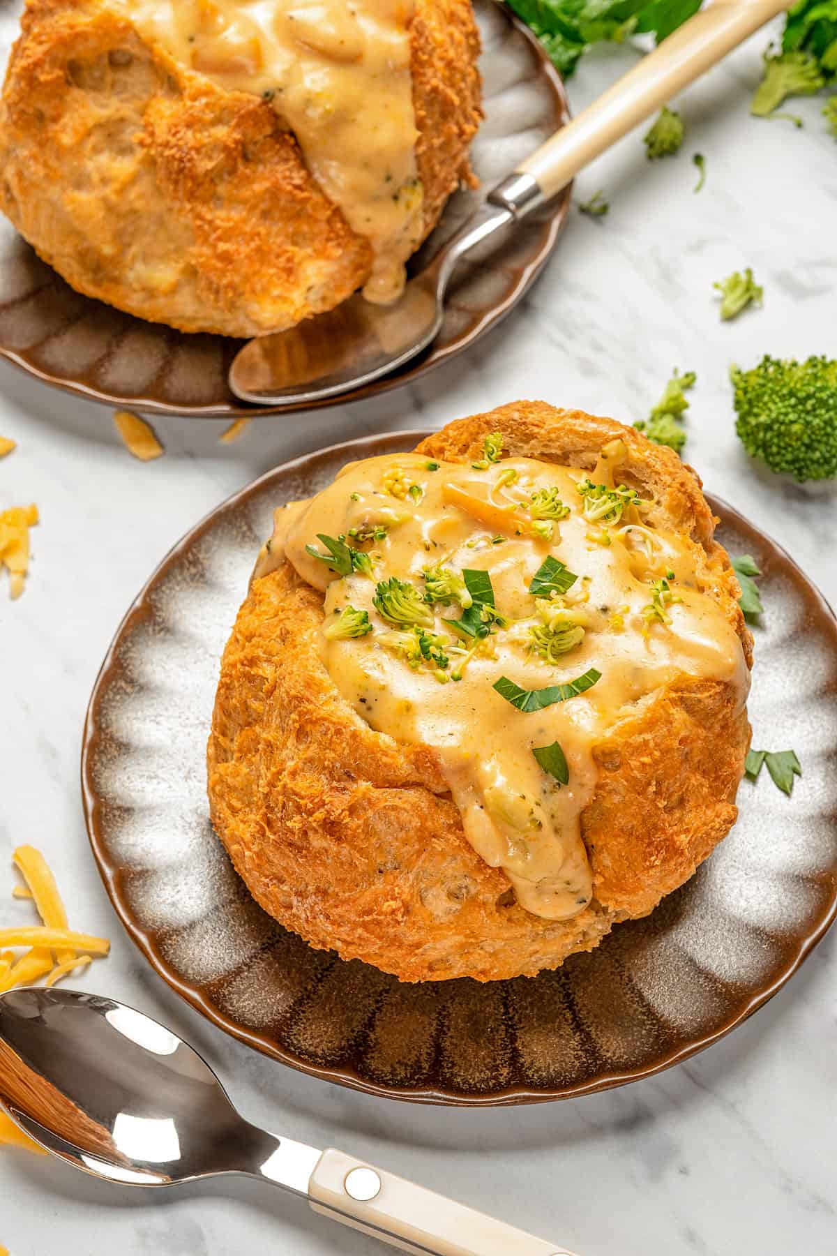 Instant Pot broccoli cheese soup served in a bread bowl.