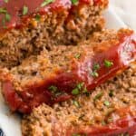 Close up of gluten-free classic meatloaf on a plate, cut into slices.