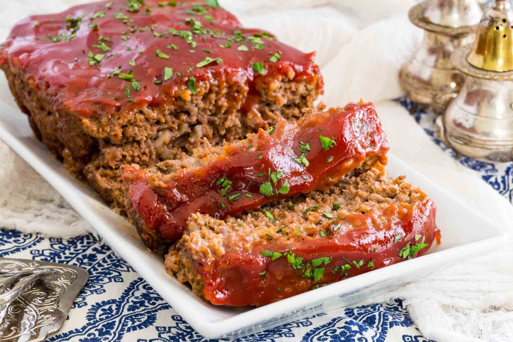 Gluten-free classic meatloaf on a plate, cut into slices.