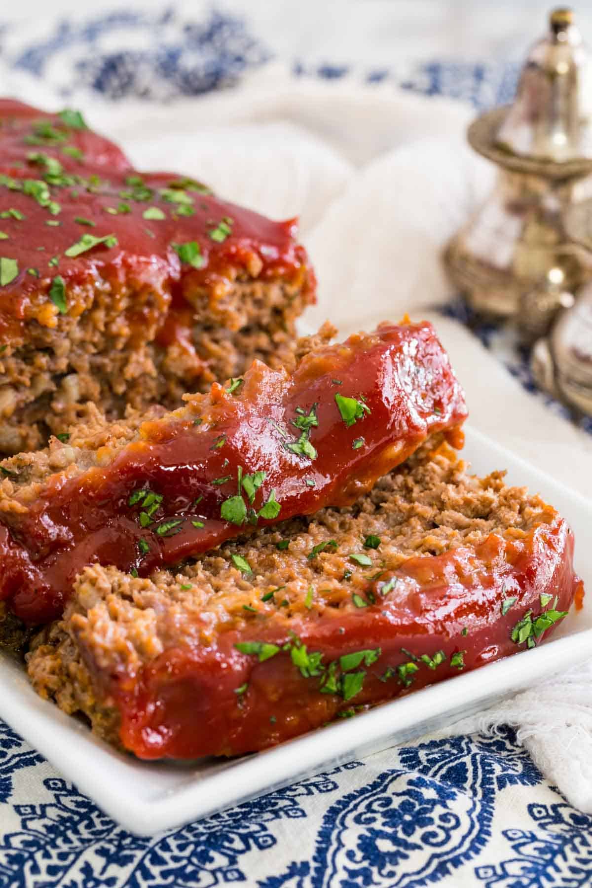 Gluten-free classic meatloaf on a plate, cut into slices.