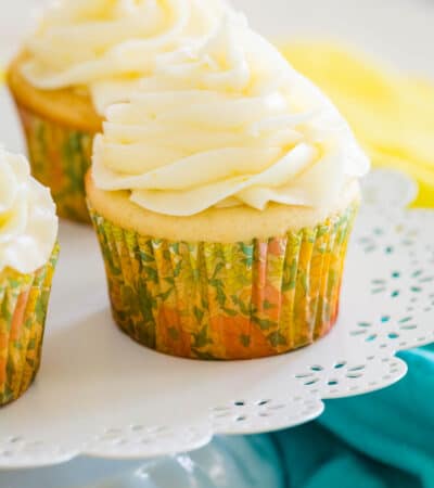 Frosted gluten-free lemon cupcakes on a cupcake stand.