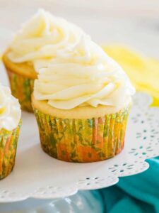 Frosted gluten-free lemon cupcakes on a cupcake stand.