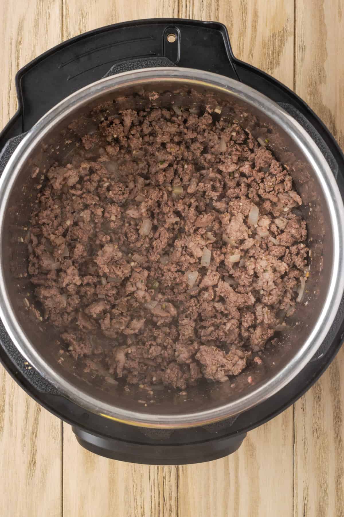 Browned meat inside the instant pot.
