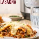 A serving of lasagna on a plate with a pressure cooker in the background with text overlay that says "Gluten Free Instant Pot Lasagna".