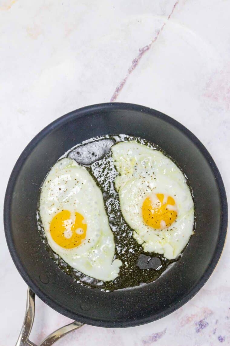 Two fried eggs in a skillet.