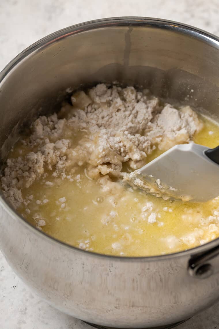 Gluten free flour stirred with water, melted butter, sugar, and salt in a saucepan.