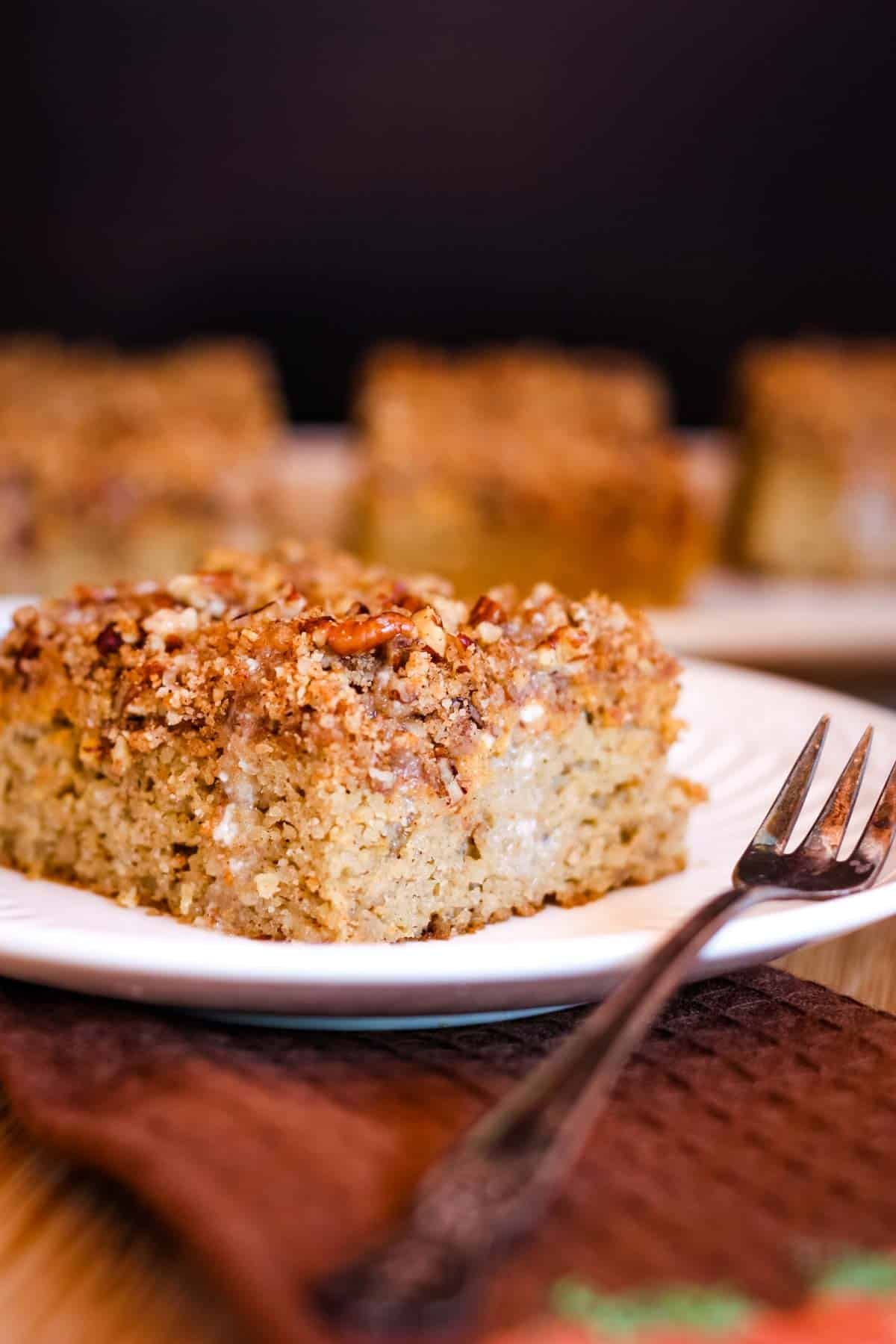 Almond Flour Pumpkin Cake Cake with Pecan Streusel on a dessert plate.