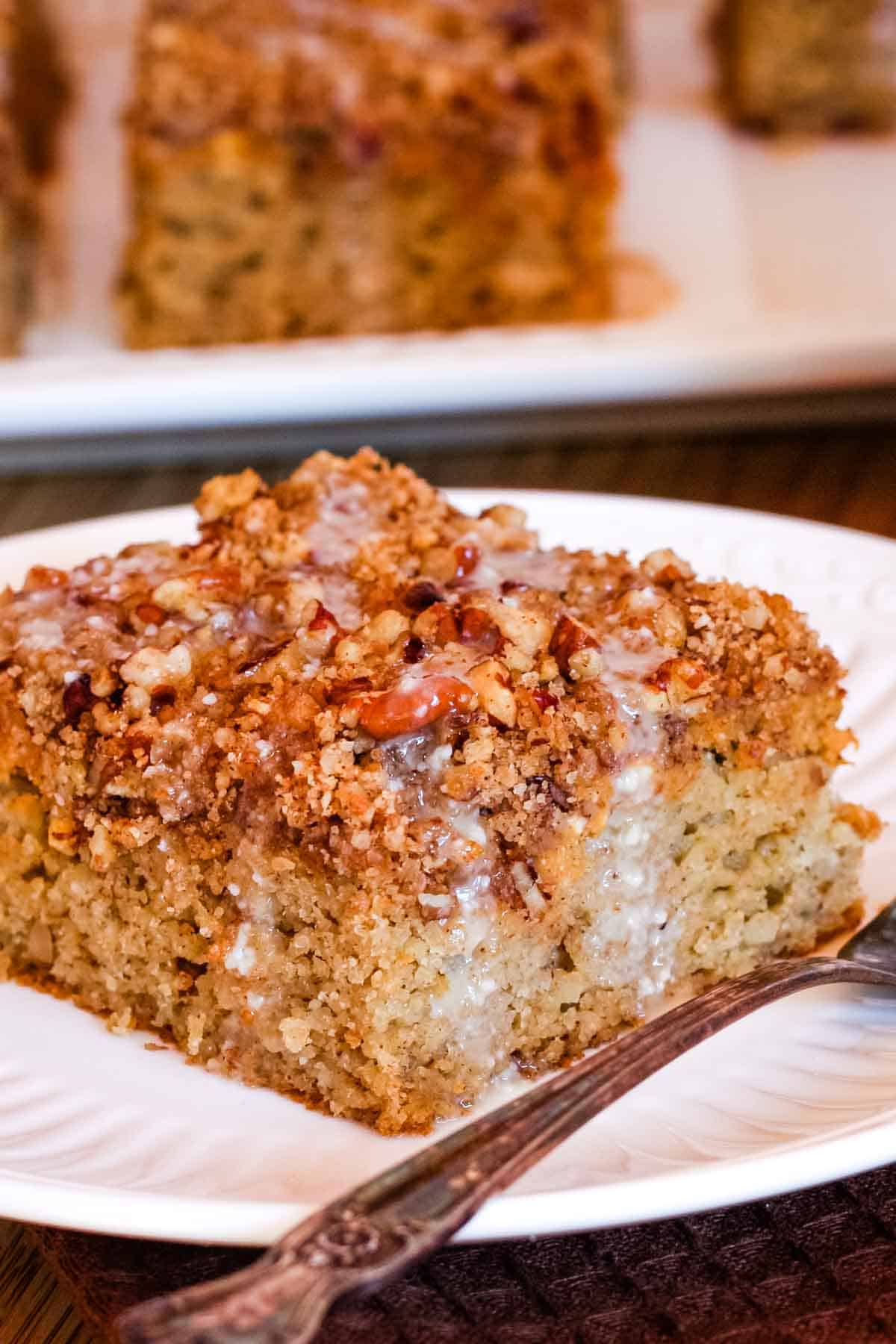 A closeup of a piece of pumpkin swirled cake with almond flour.