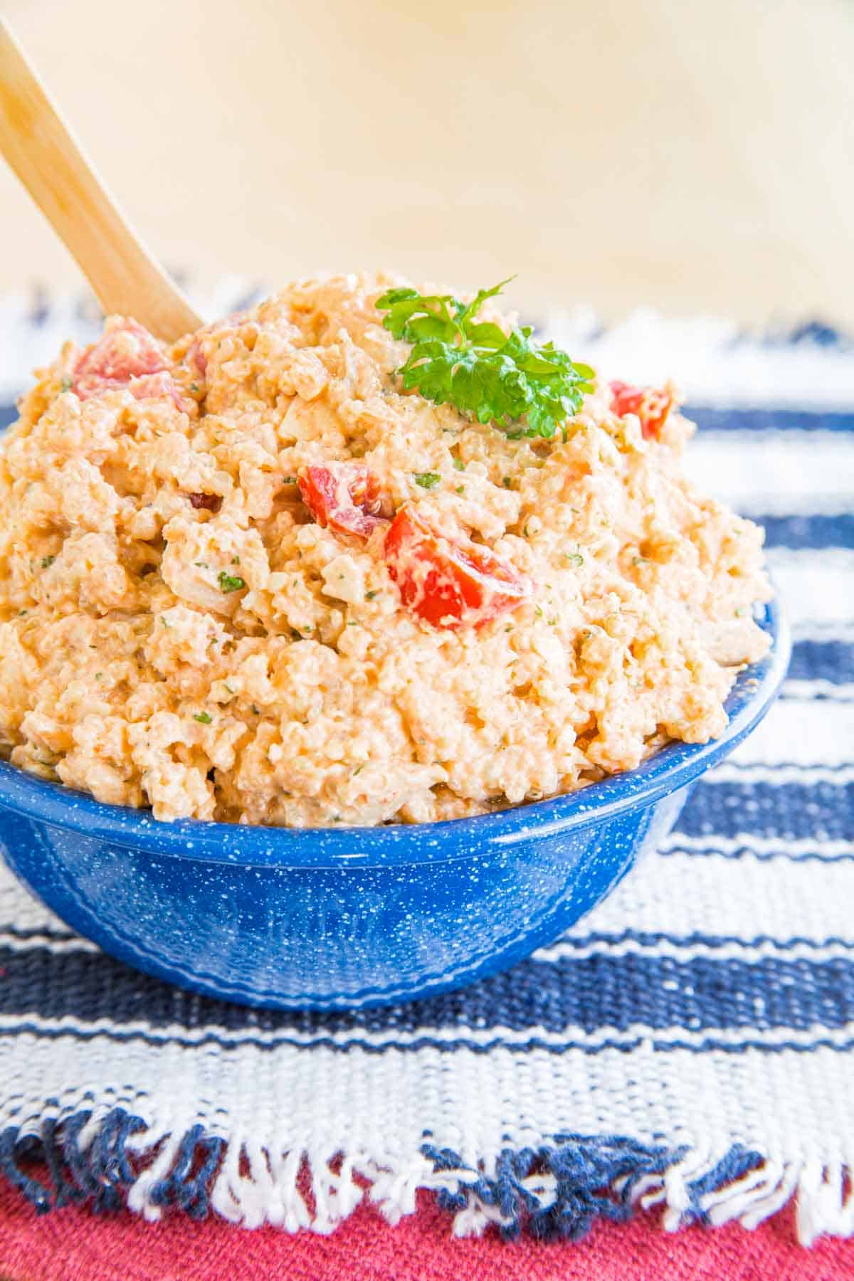 Barbecue Ranch Quinoa Chicken Salad piled in a blue bowl.