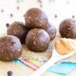 Banana Chocolate Peanut Butter Energy Balls on a piece of burlap.