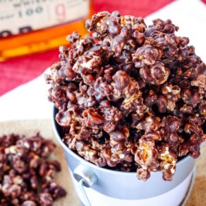 Bourbon chocolate popcorn overflowing from a bucket.