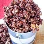 Bourbon chocolate popcorn overflowing from a metal bucket.