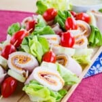 A platter of salad skewers with meats, cheese, and veggies on toothpicks with text overlay that says "Chef Salad on a Stick".