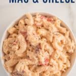 A bowl of gluten free mac and cheese with bacon, chicken, and tomatoes with text overlay that says "Chicken Mac & Cheese".