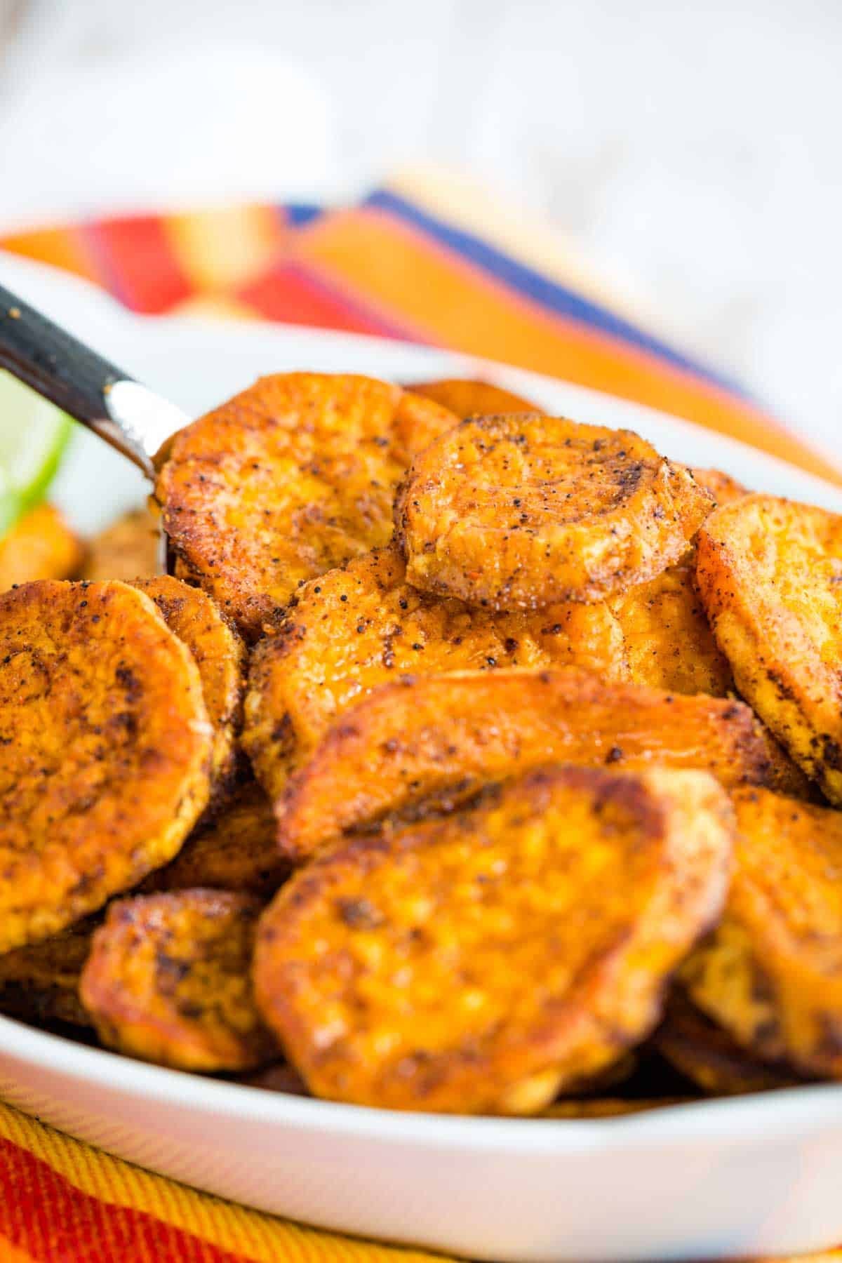 Closeup of the finished dish of baked sweet potato slices.