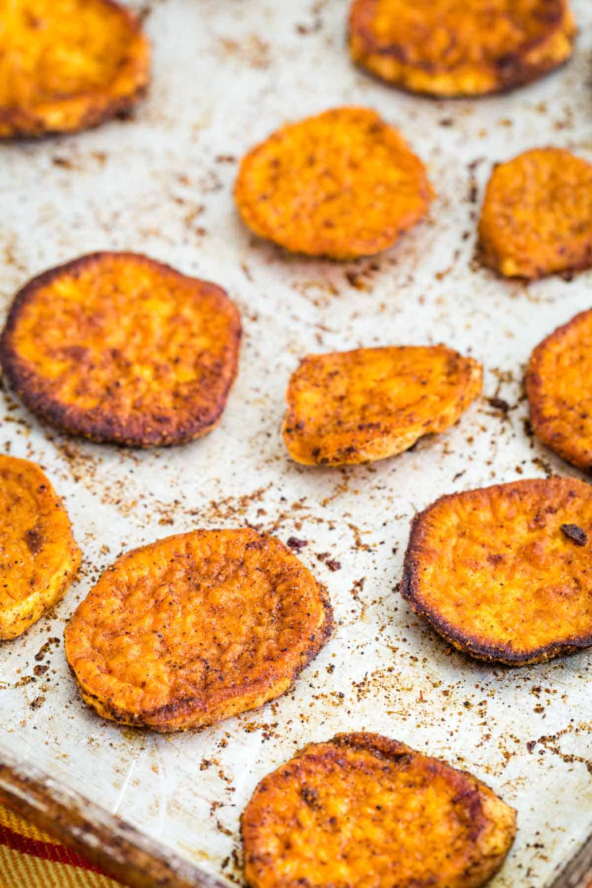 Roasted Sweet Potato Slices on a baking sheet.
