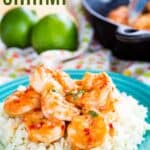Shrimp coated in sauce over cauliflower rice on a turquoise plate with text overlay that says "Chili Lime Shrimp".,