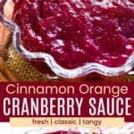 Cranberry sauce in a scalloped glass bowl with a spoon from overhead and the side divided by a red box with text overlay that says "Cinnamon Orange Cranberry Sauce" and the words fresh, classic, and tangy.