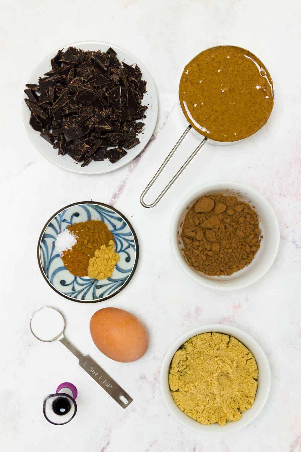 All of the ingredients to make the cookies on a marble countertop.