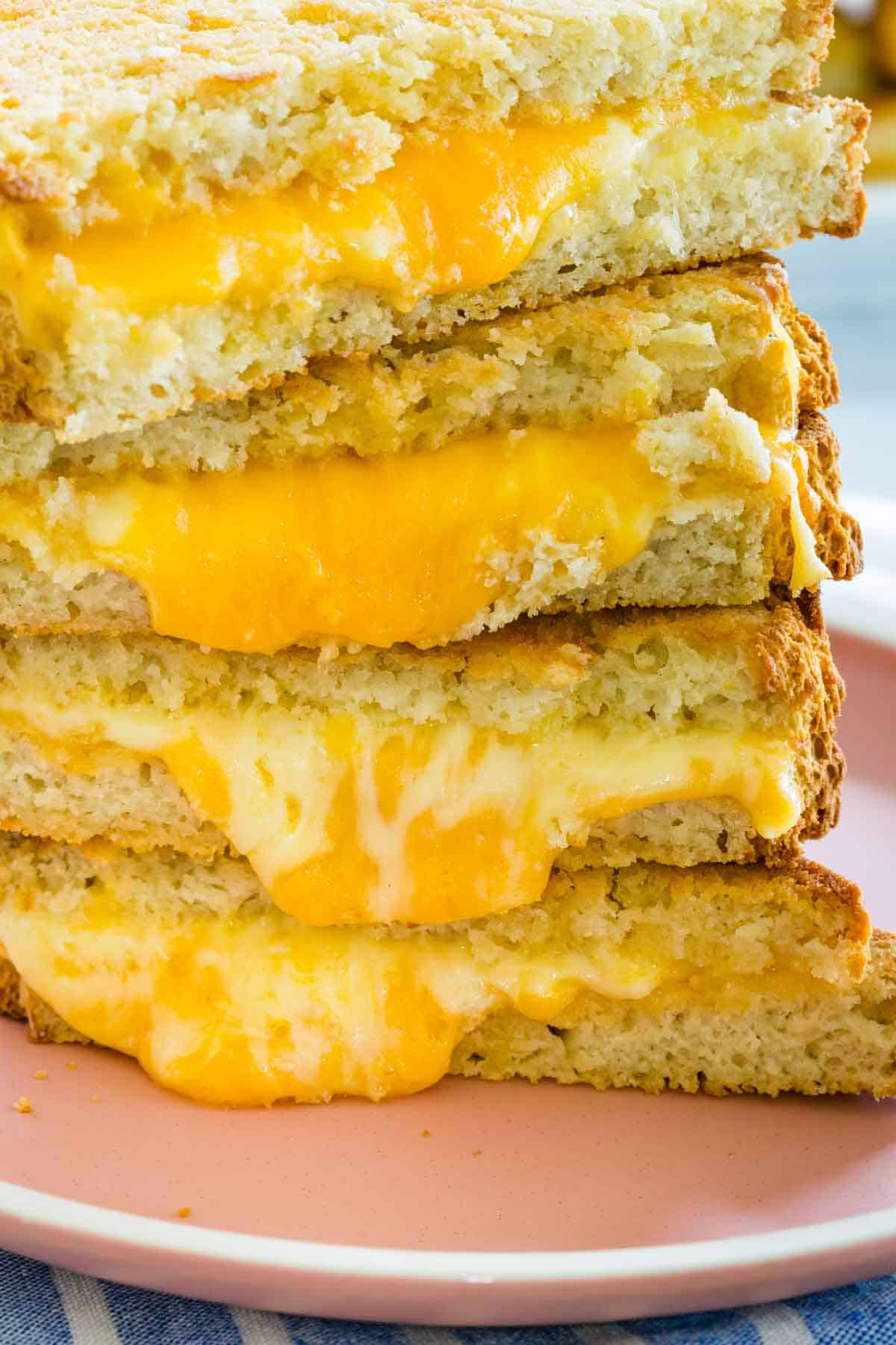 A stack of gluten-free grilled cheese sandwich halves.