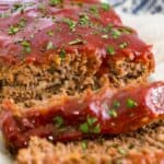 Sliced meatloaf on a platter with text overlay that says "Gluten Free Classic Meatloaf".