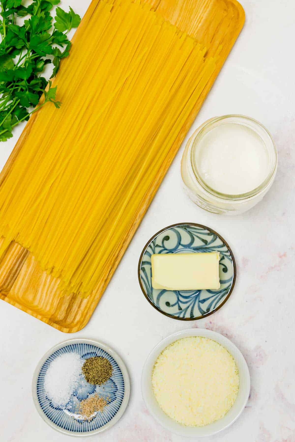 Ingredients including gluten-free pasta, butter, cream, and cheese are shown for Gluten-Free Fettuccine Alfredo.