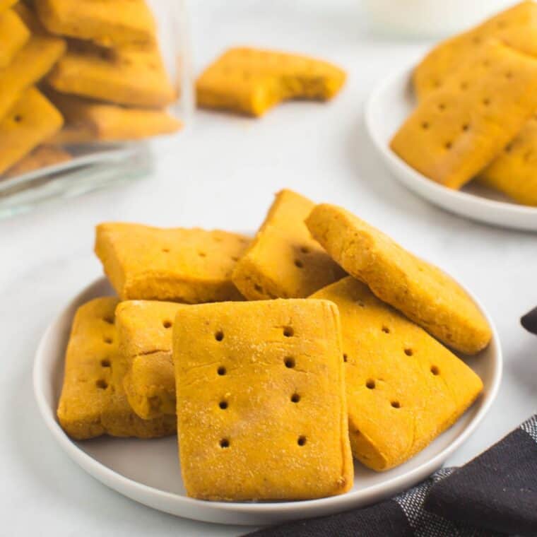 pumpkin graham crackers piled on plate.