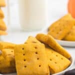 A pile of rectangular cookies on a plate with text overlay that says "Gluten Free Pumpkin Graham Crackers".