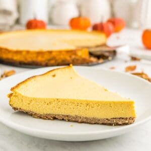 A piece of gluten free pumpkin tart on a white plate.