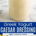 A jar of creamy salad dressing and a spoonful of dressing resting on top of the jar divided by a blue box with text overlay that says "Greek Caesar Dressing" and the words creamy, light, and easy.