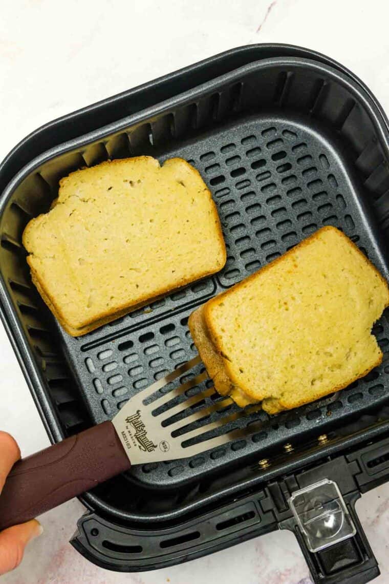 Gluten-free grilled cheese sandwiches cook in an air fryer.