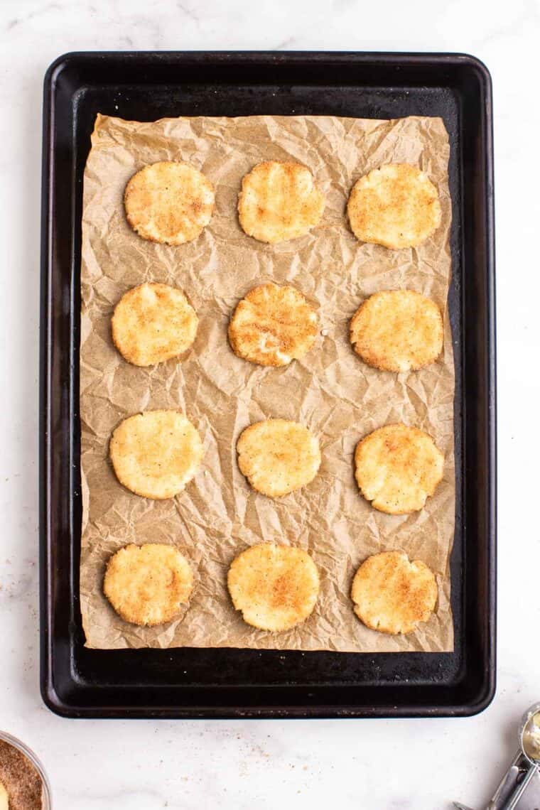 Pressed down cookie dough on a sheet pan.