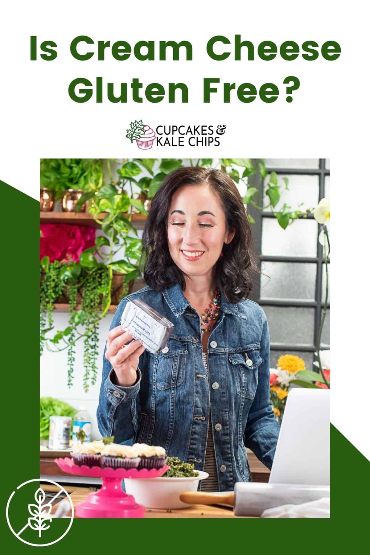 A woman standing at a kitchen countertop holding a package of cream cheese on a green and white background with text overlay that says, "Is Cream Cheese Gluten Free?"