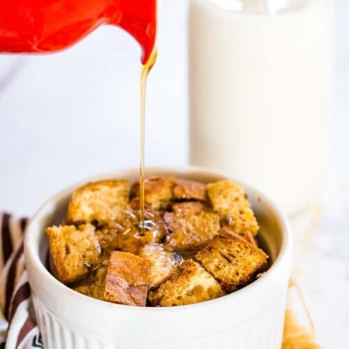 Pouring maple syrup on a French Toast Casserole for One.