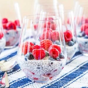 Chia pudding and berries layered in glasses.