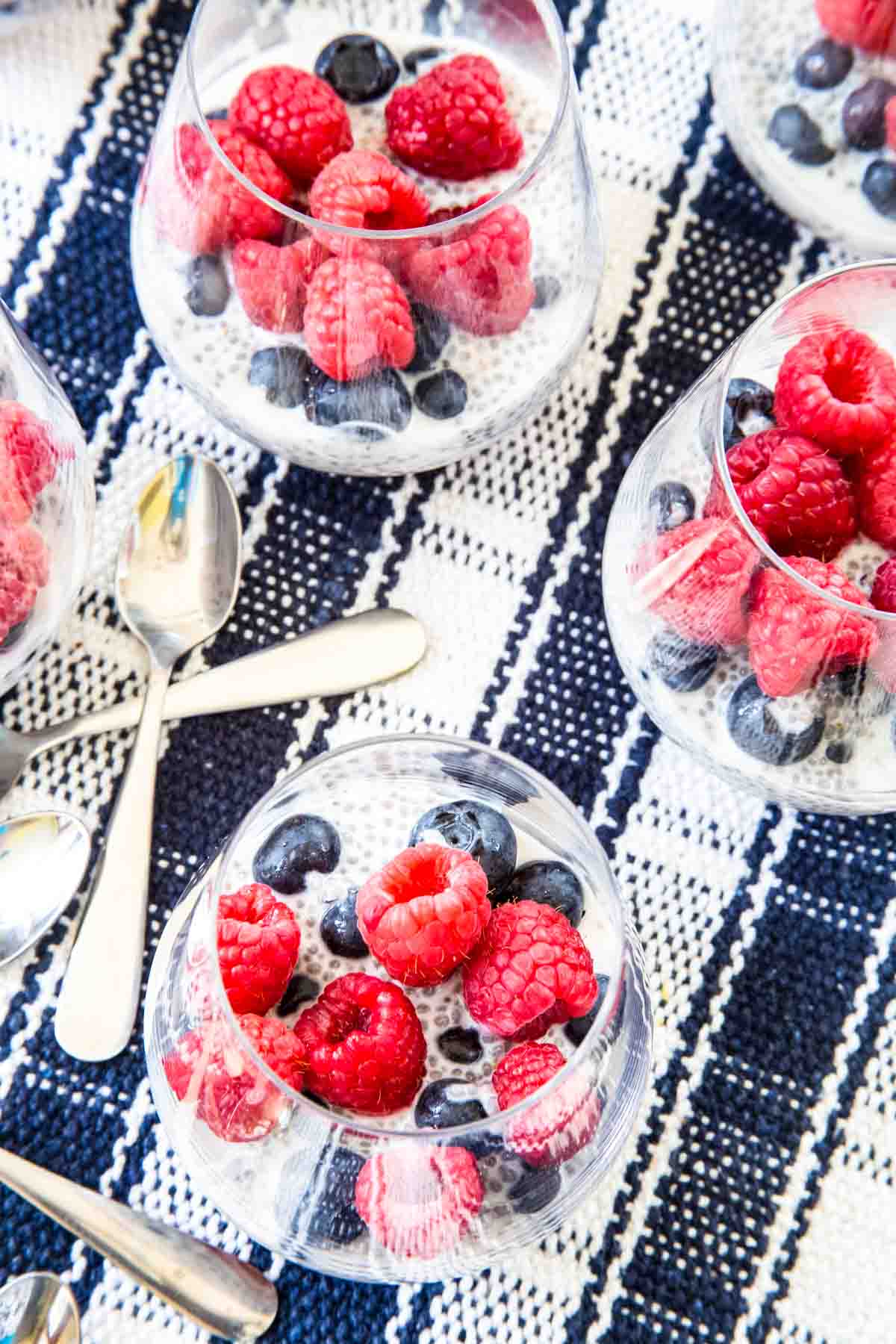 Looking down into glasses of chia pudding with berries.