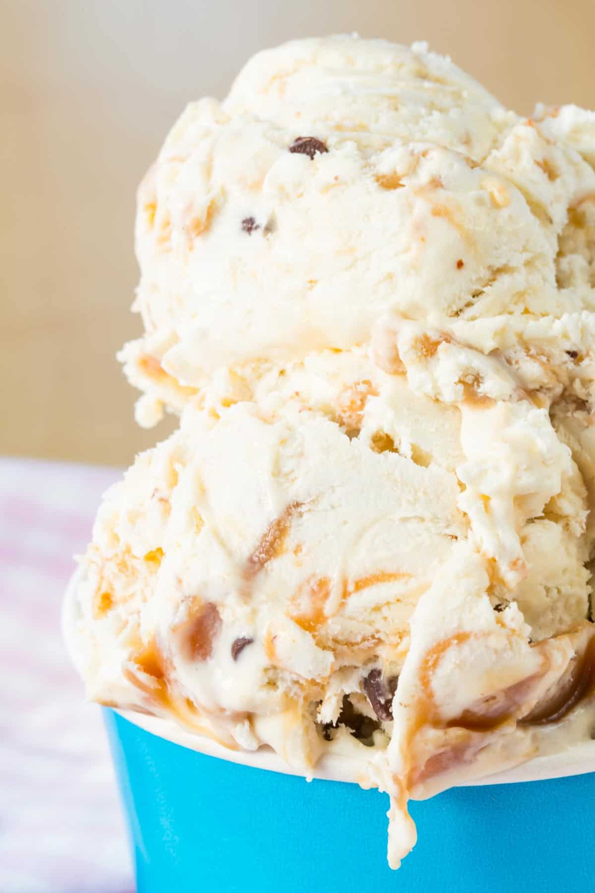 A closeup of scoops of caramel toffee ice cream.
